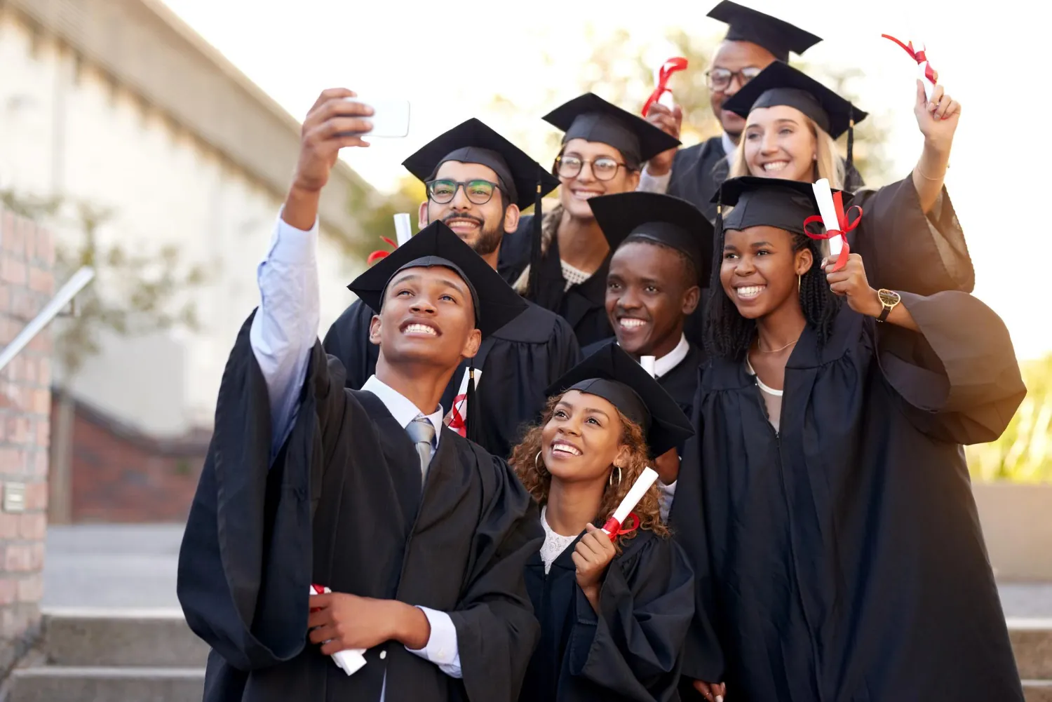Graduates celebrating together after the ceremony