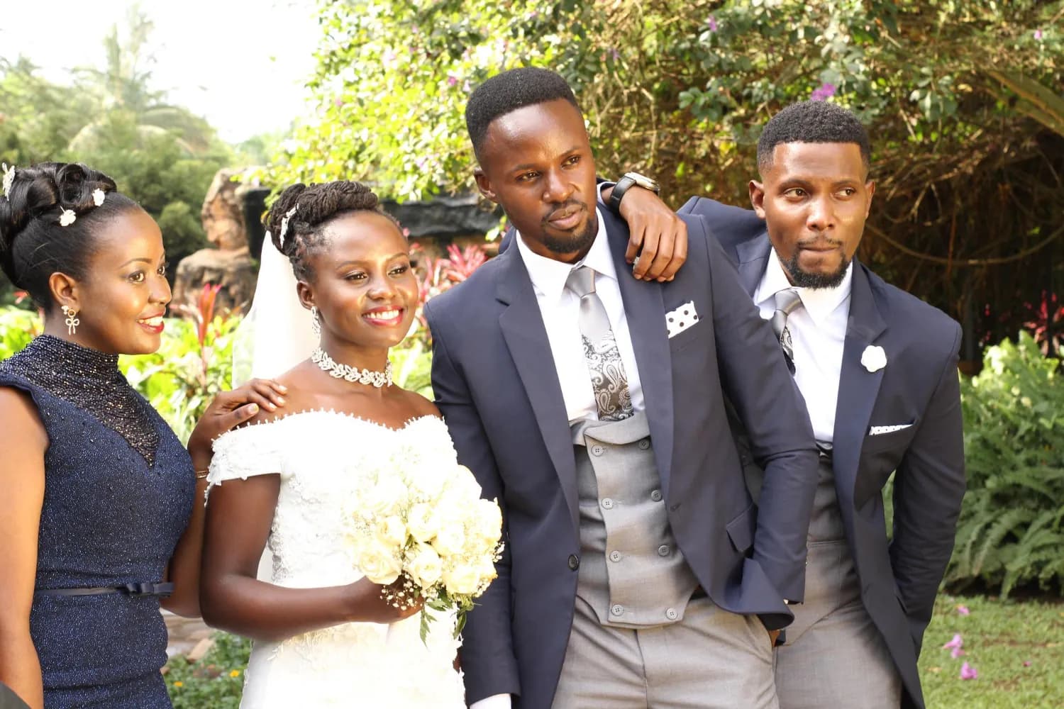 Bride and groom surrounded by family at a wedding